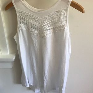 Sleeveless white tank.